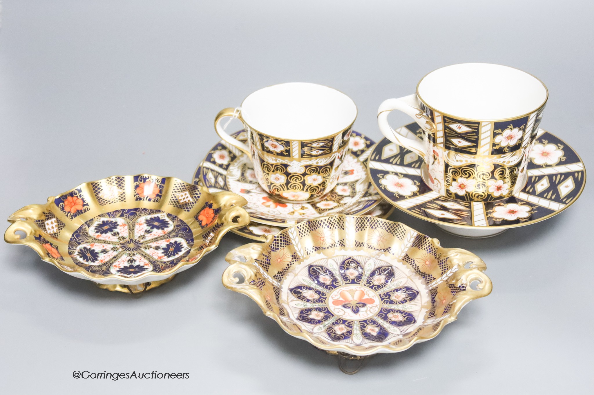 A quantity of Royal Crown Derby cups, plates and dishes